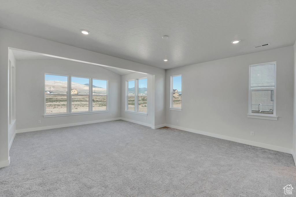 Spare room with carpet floors, baseboards, and recessed lighting
