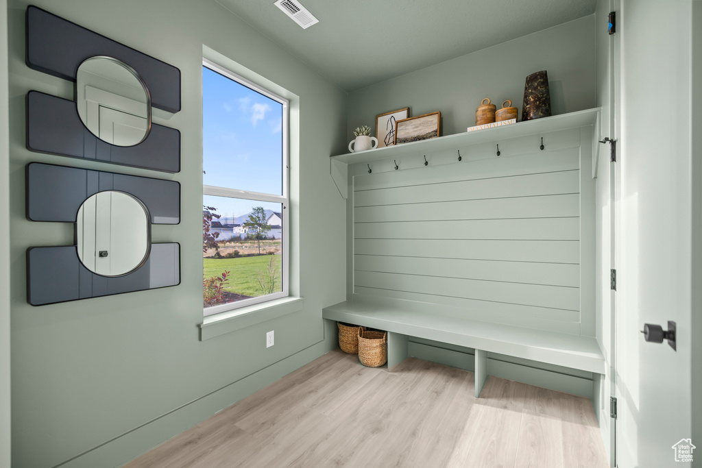 Mudroom with wood finished floors