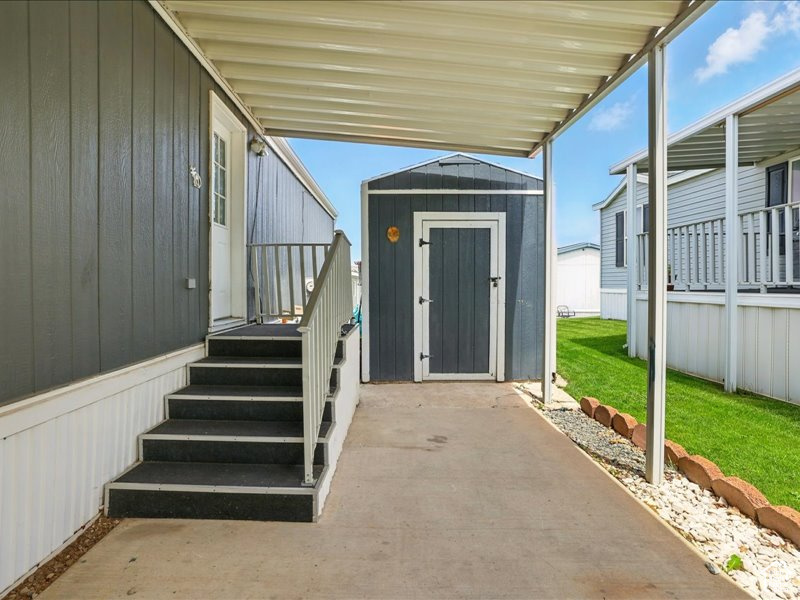 Property entrance with a yard