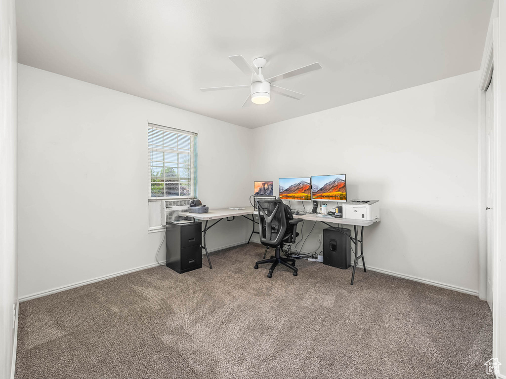 Office area with carpet floors, a ceiling fan, and cooling unit