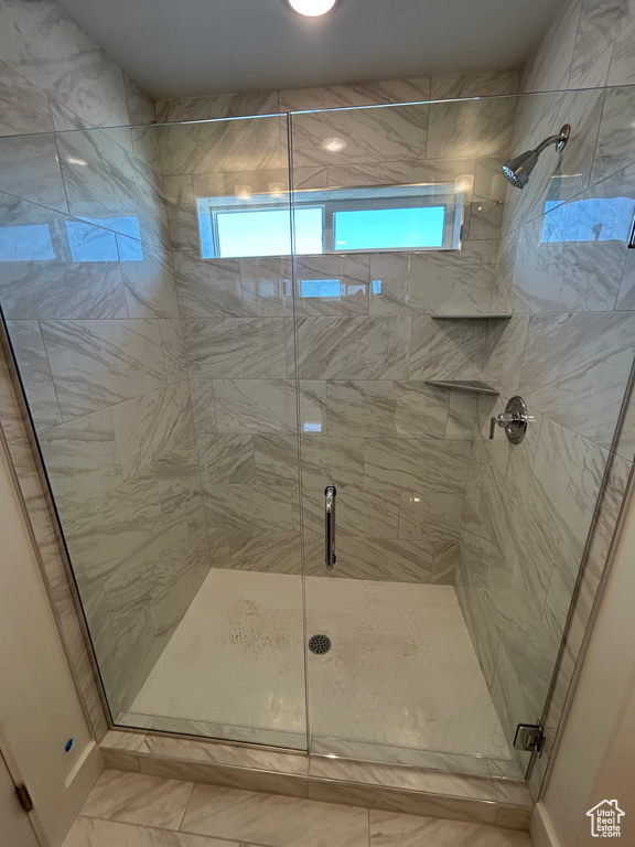 Full bath with a shower stall