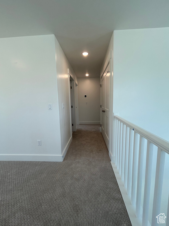 Corridor featuring carpet floors, recessed lighting, and baseboards