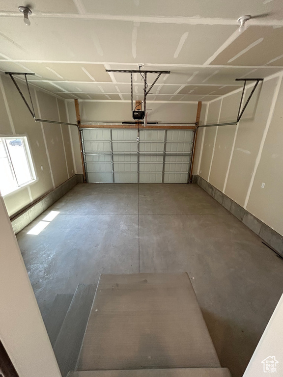 Garage featuring a garage door opener