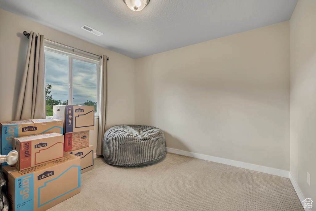 Miscellaneous room with carpet floors and baseboards