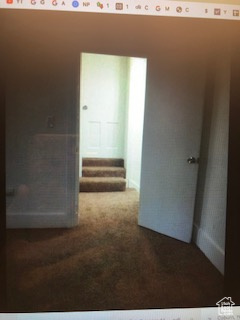 Spare room featuring carpet