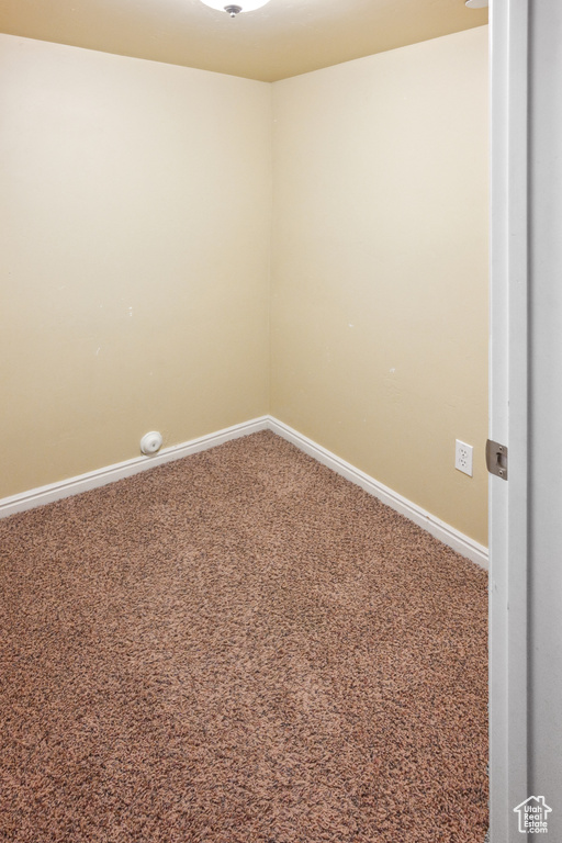 Unfurnished room featuring carpet flooring and baseboards