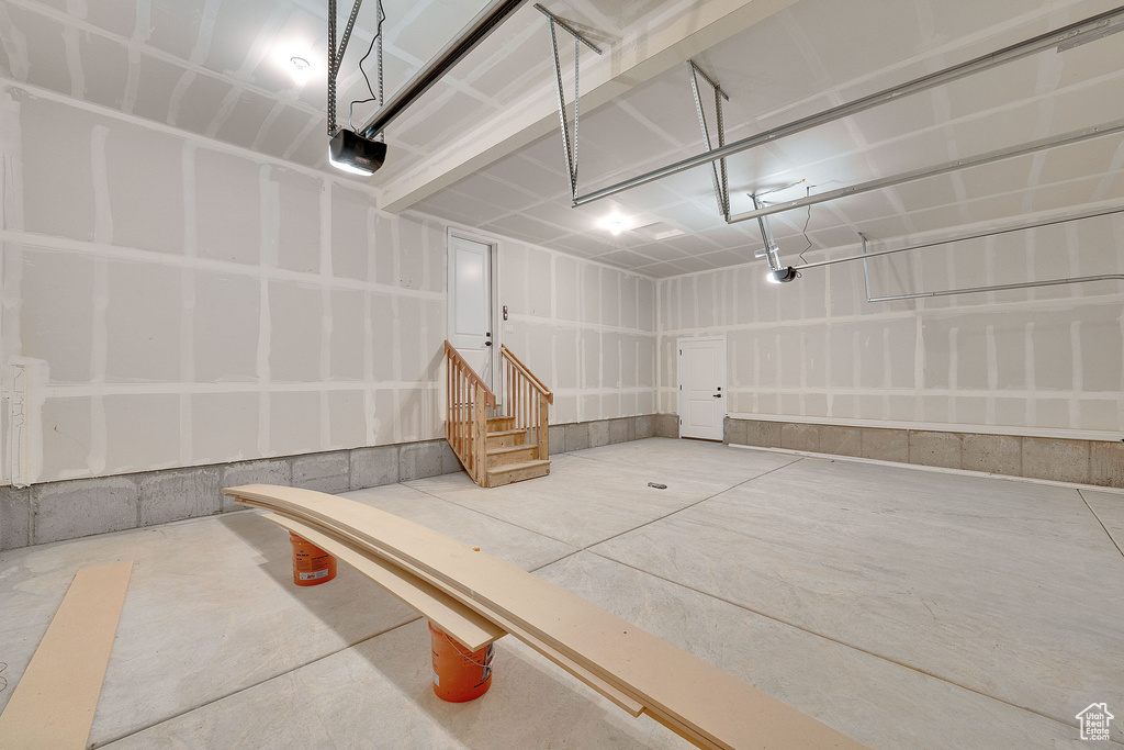 Garage featuring a garage door opener