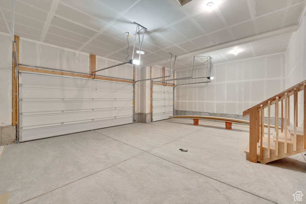 Garage featuring a garage door opener