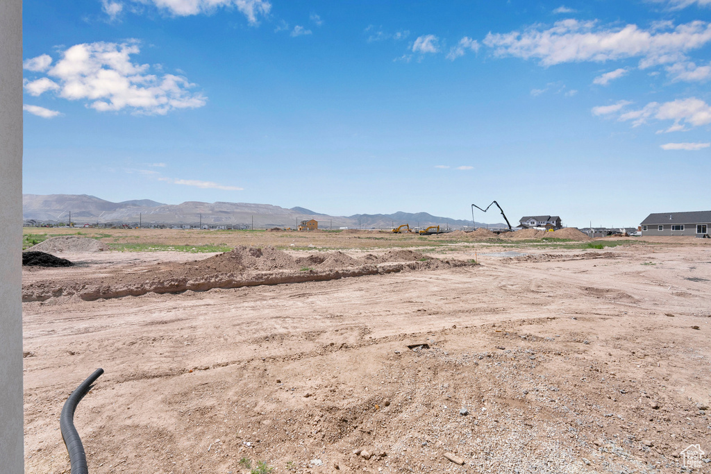 View of yard with a mountain view and a rural view