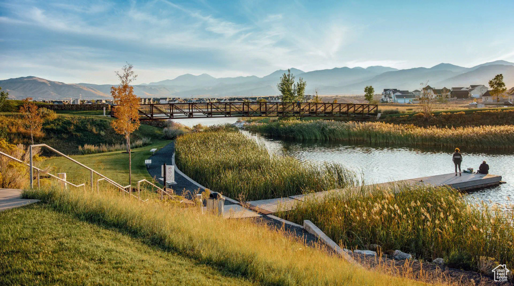 Surrounding community with a water and mountain view