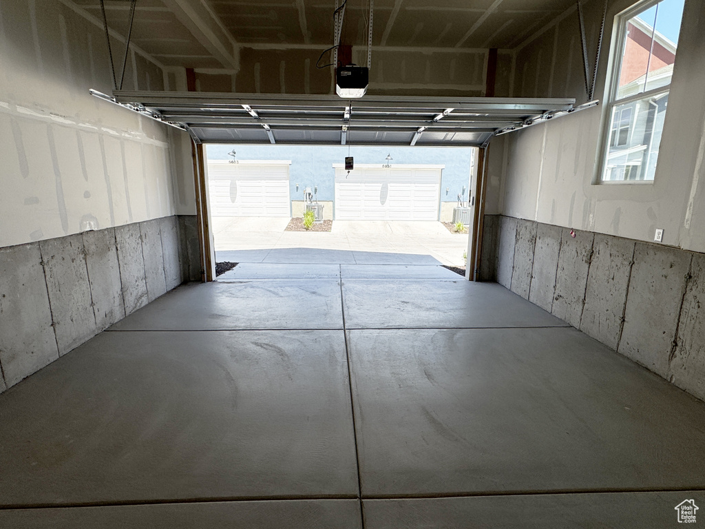 Garage featuring a garage door opener