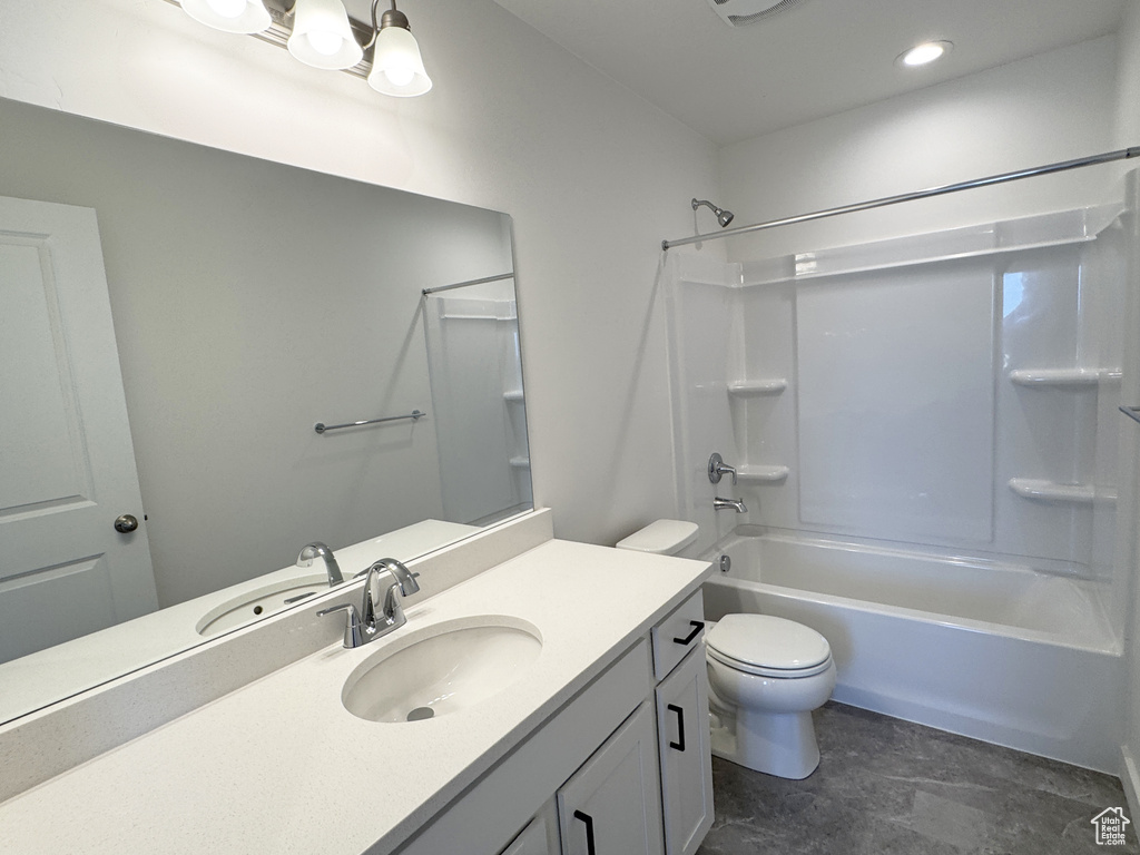 Full bath with toilet, vanity, and shower / bathtub combination