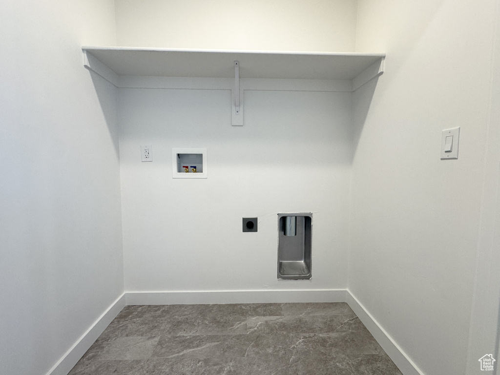 Laundry room featuring baseboards, hookup for a washing machine, and hookup for an electric dryer