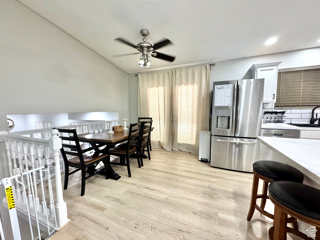 Dining space featuring ceiling fan, light wood-style floors, and recessed lighting