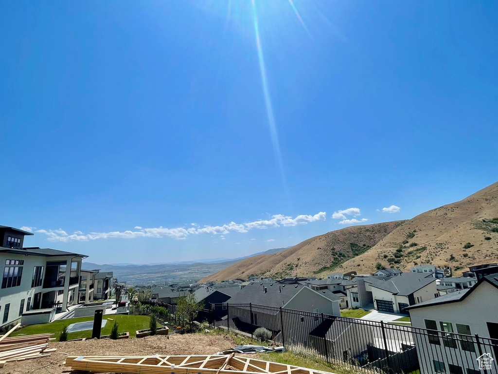 View of mountain backdrop featuring nearby suburban area