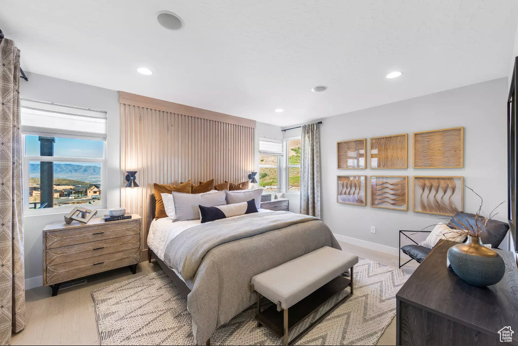 Bedroom featuring recessed lighting, baseboards, and light wood finished floors