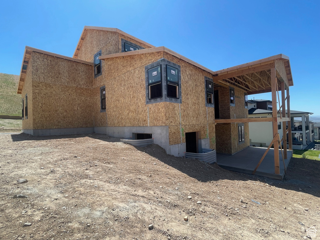 Rear view of property with a patio area