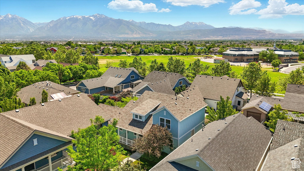 Aerial view of residential area featuring a mountainous background