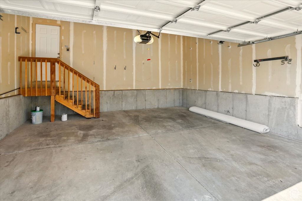 Garage featuring a garage door opener