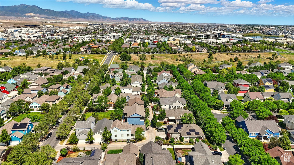Aerial perspective of suburban area with a mountainous background