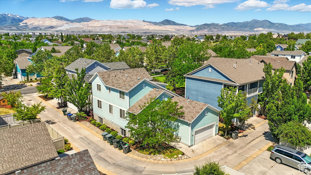 Aerial perspective of suburban area with a mountain backdrop