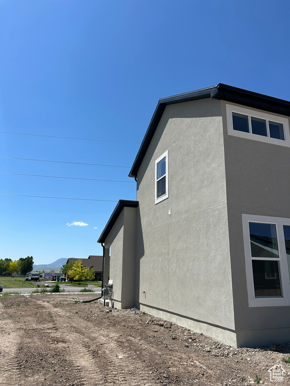 View of home's exterior featuring stucco siding