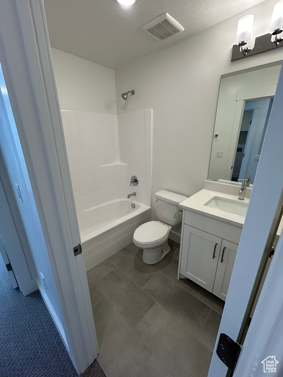 Bathroom with vanity, toilet, and bathtub / shower combination