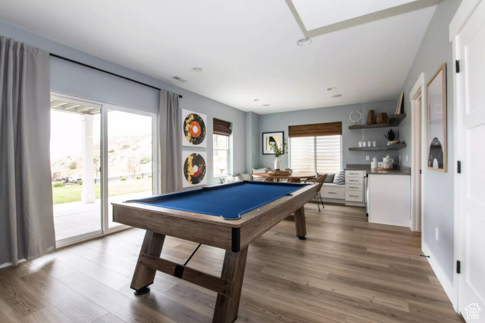 Rec room featuring wood finished floors, billiards, and recessed lighting