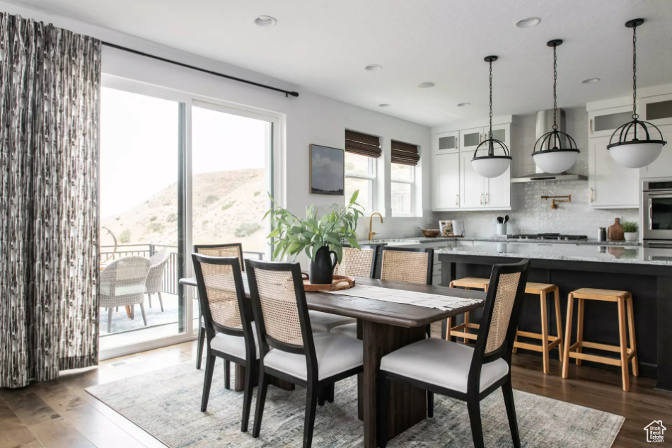 Dining area featuring wood finished floors and recessed lighting