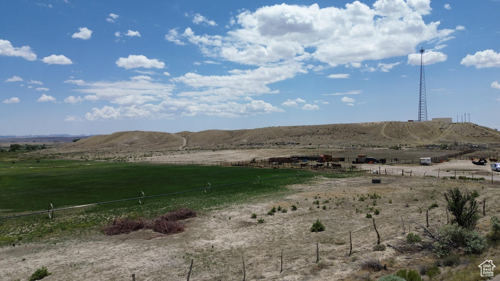 View of mountain backdrop featuring rural landscape