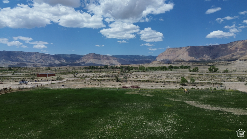 View of mountain backdrop featuring rural landscape