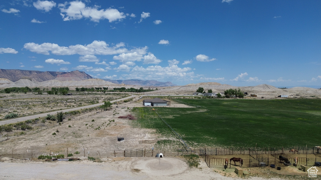 View of mountain backdrop with rural landscape
