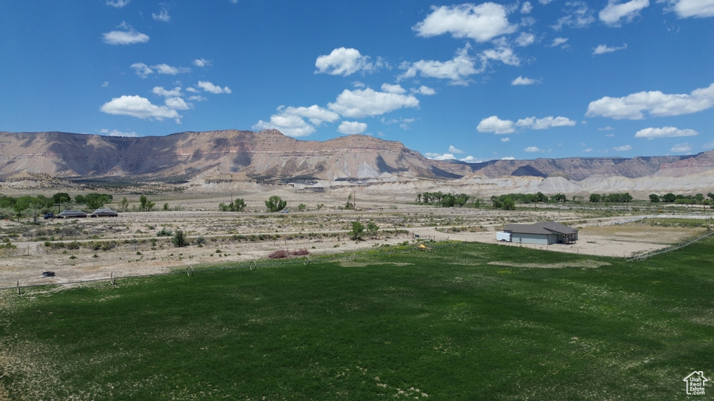 View of mountain backdrop with rural landscape