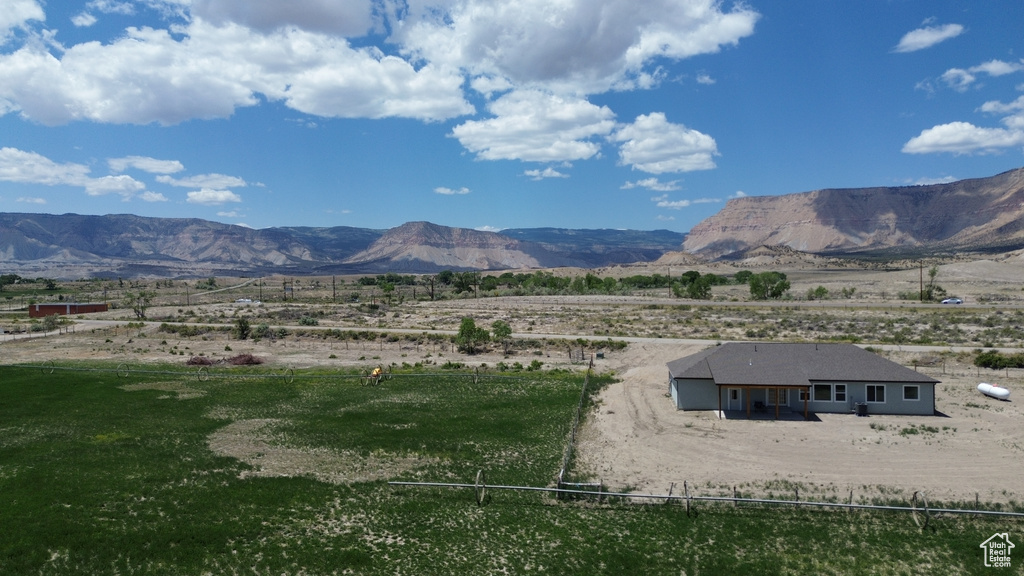 View of mountain background featuring rural landscape