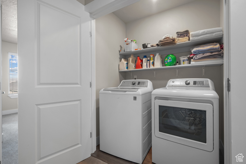 Laundry room featuring separate washer and dryer