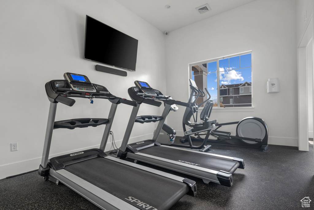 Exercise room featuring baseboards