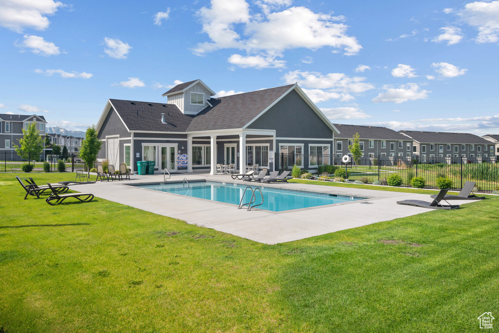 View of pool featuring a patio area and a residential view