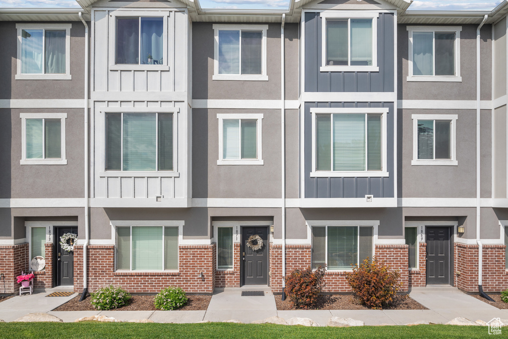 Multi unit property featuring brick siding and board and batten siding