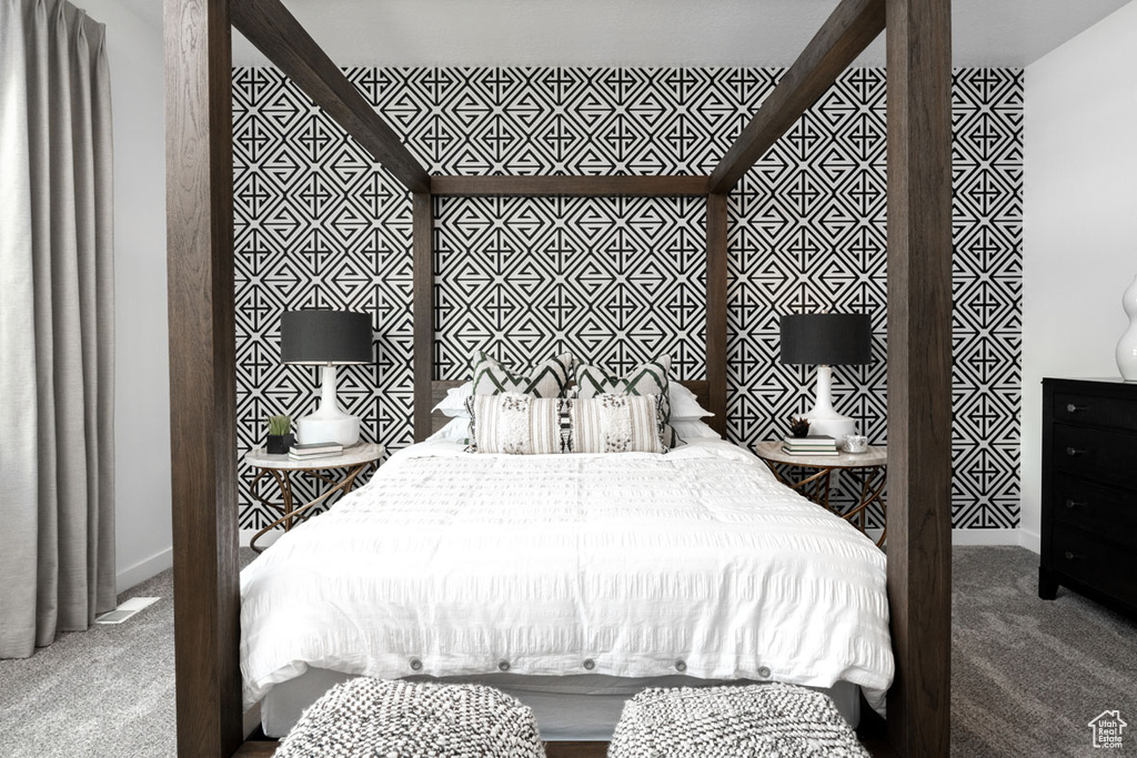Carpeted bedroom featuring baseboards