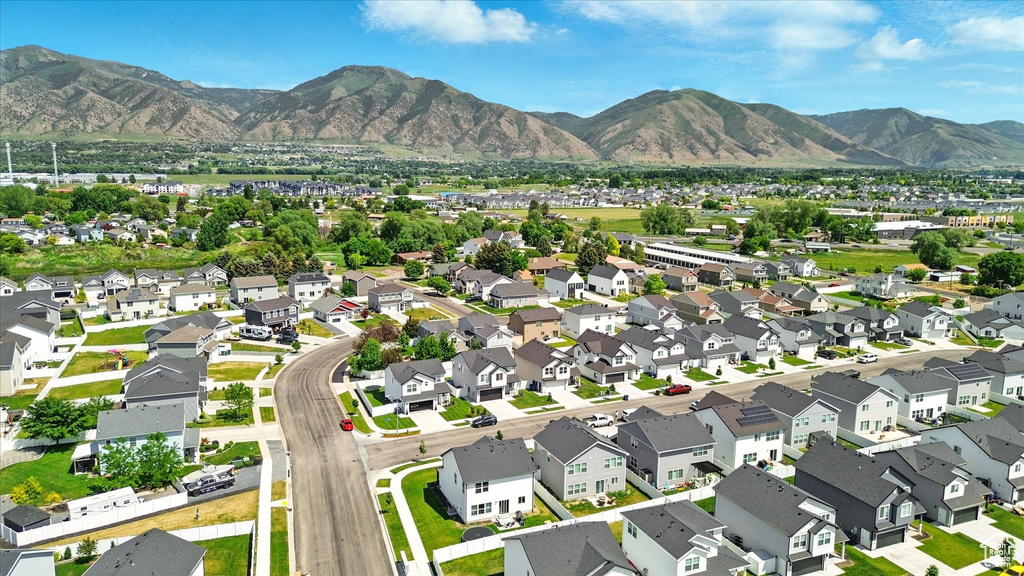 Aerial perspective of suburban area with a mountain backdrop