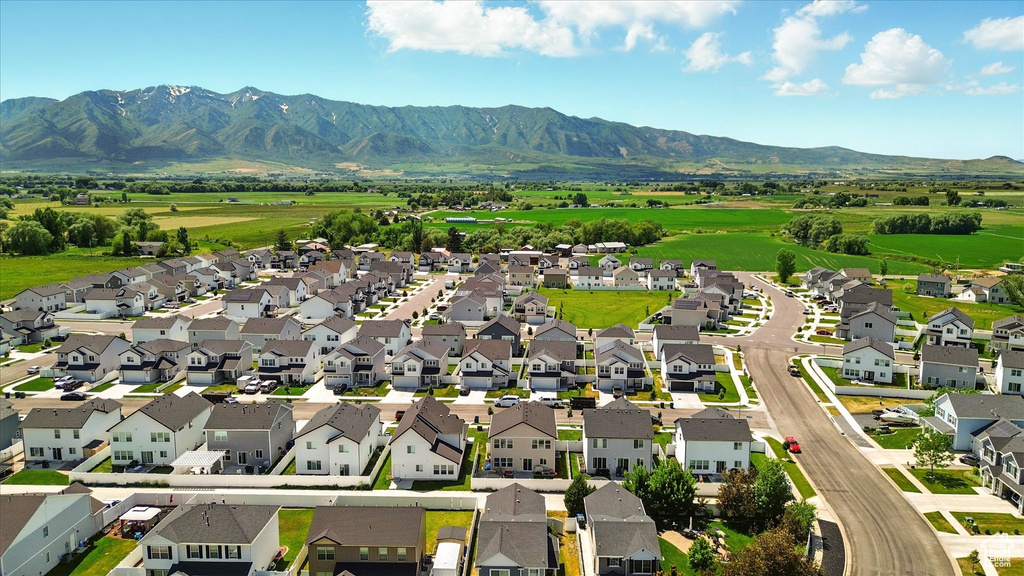 Aerial perspective of suburban area with a mountainous background