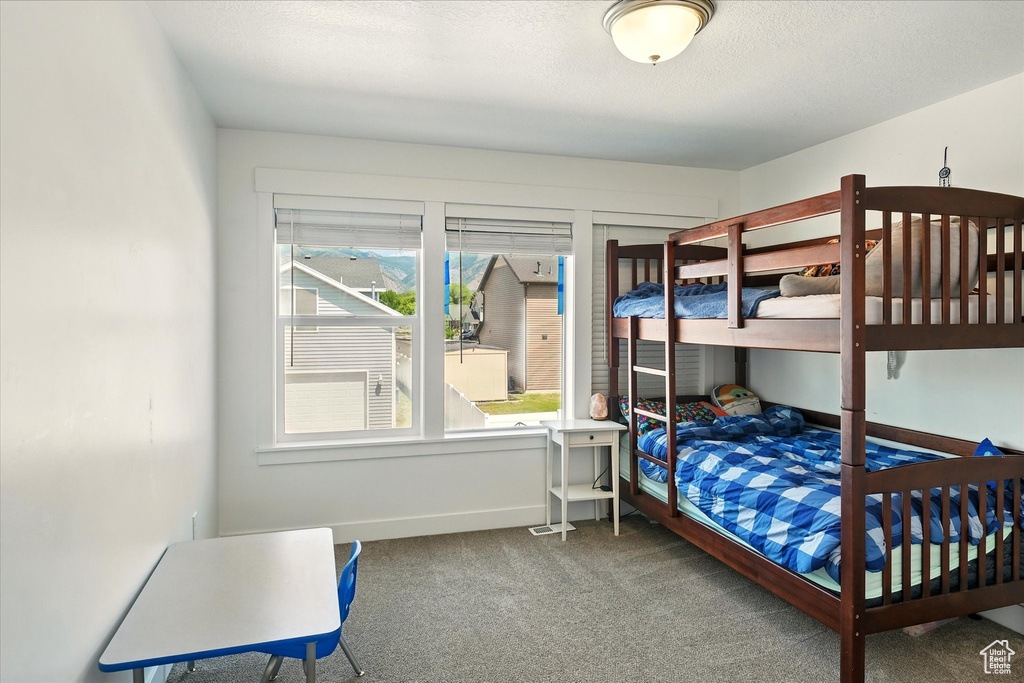 Carpeted bedroom with baseboards