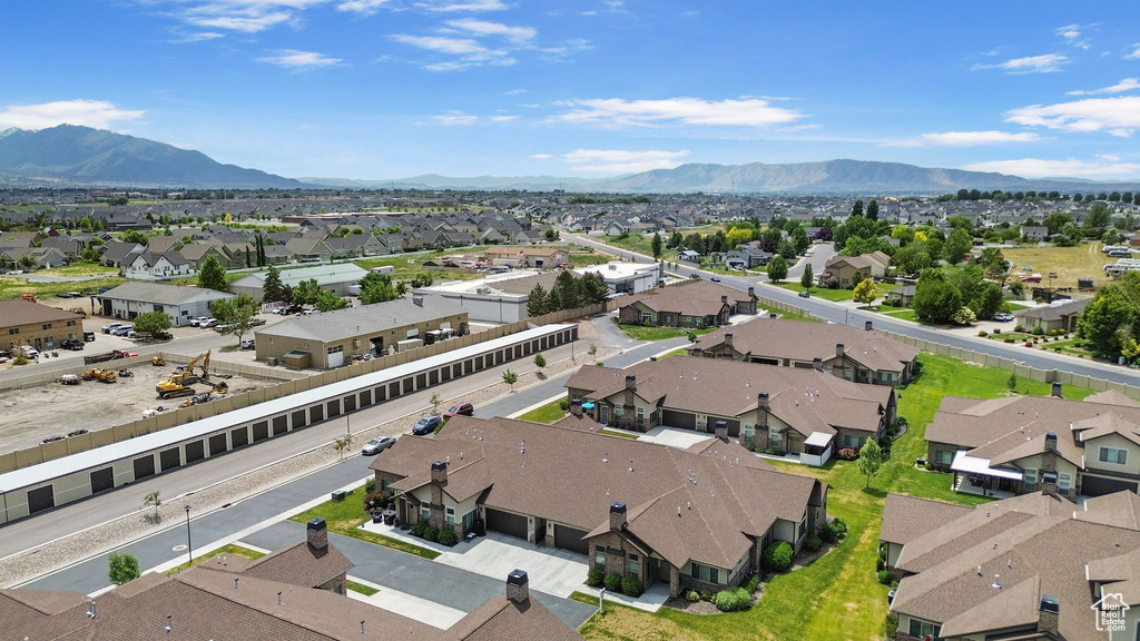 Aerial perspective of suburban area with a mountain backdrop
