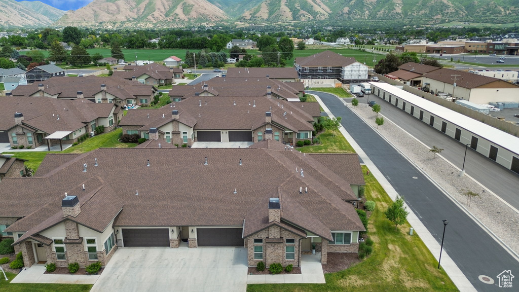 Aerial perspective of suburban area with a mountainous background
