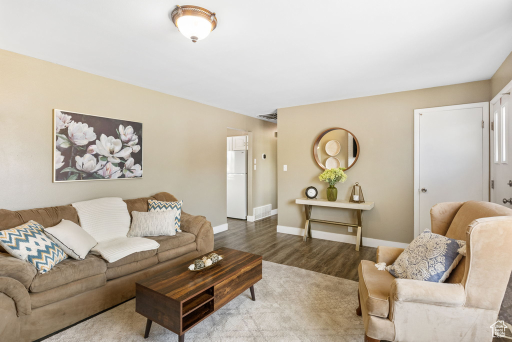 Living area featuring wood finished floors and baseboards