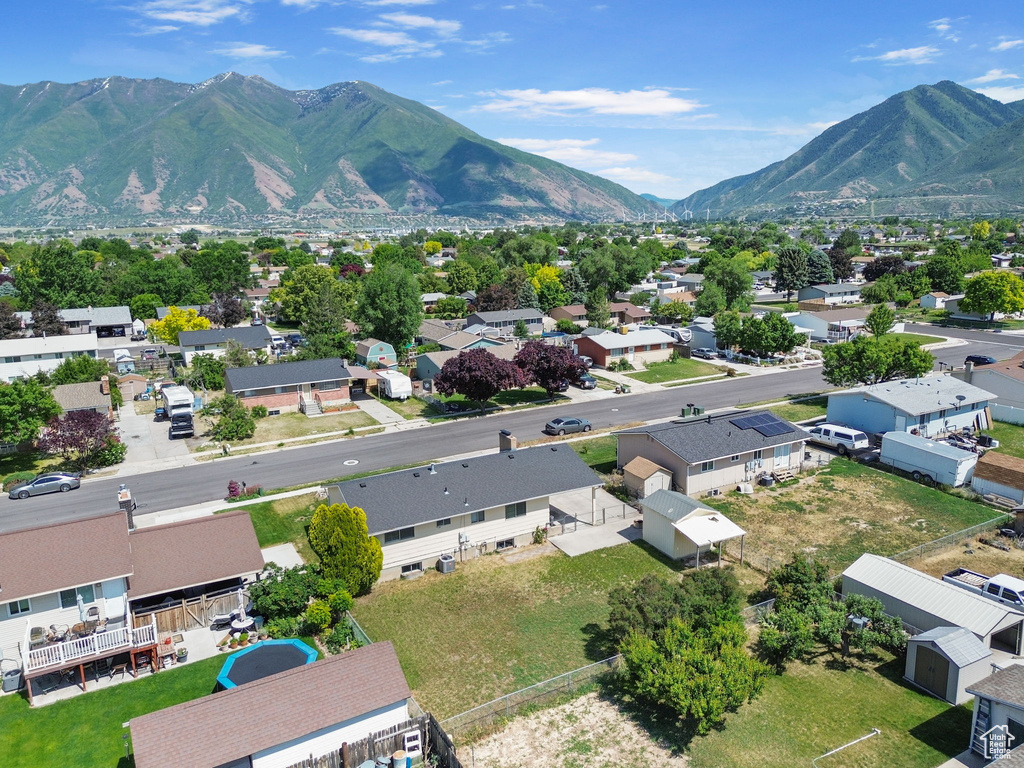 View of mountain backdrop featuring nearby suburban area