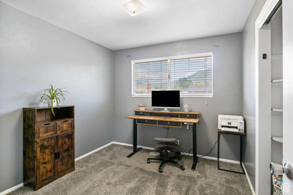 Carpeted office with baseboards