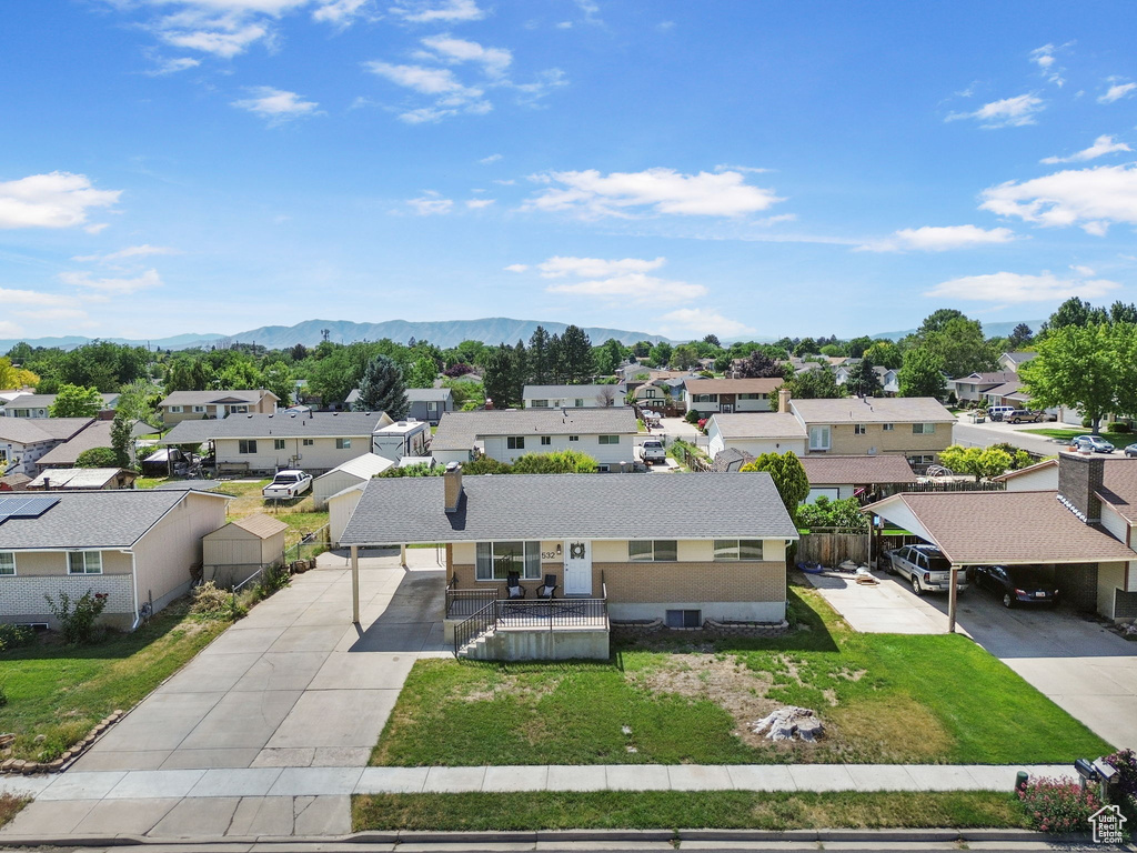 Aerial perspective of suburban area featuring a mountainous background