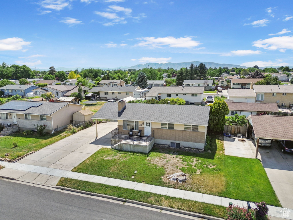Aerial perspective of suburban area with a mountainous background