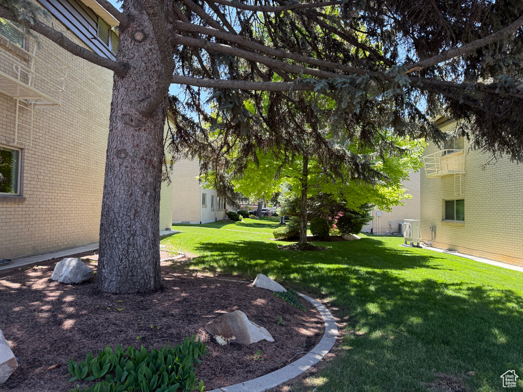 View of green lawn with central AC